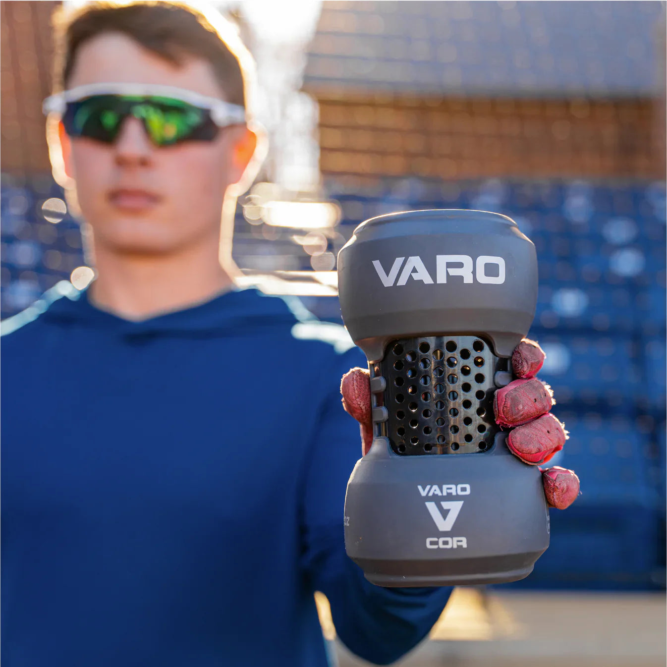 Young hitter holding the Vettex x Varo bat training weight — MLB Authentic, used by USA Baseball, the gold standard for overload bat speed and exit velocity training